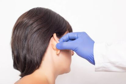 dermatologist-touching-ear