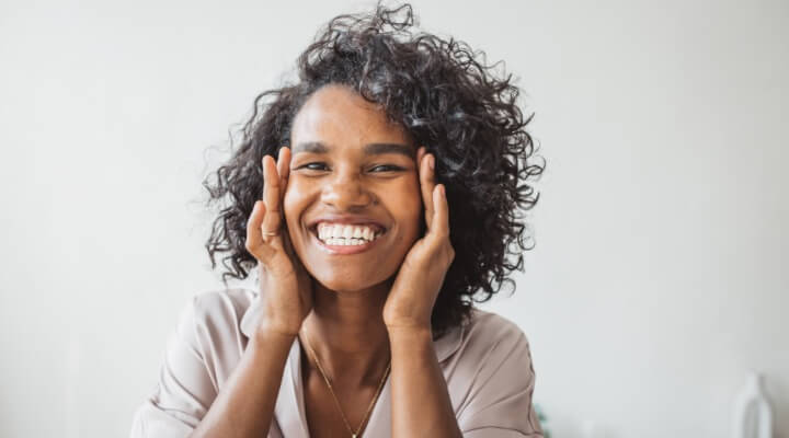 woman with hands on face